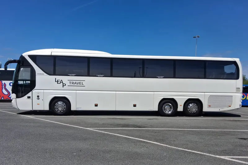 Side view of the Leap Travel 55-seat Tourliner coach in Llandudno