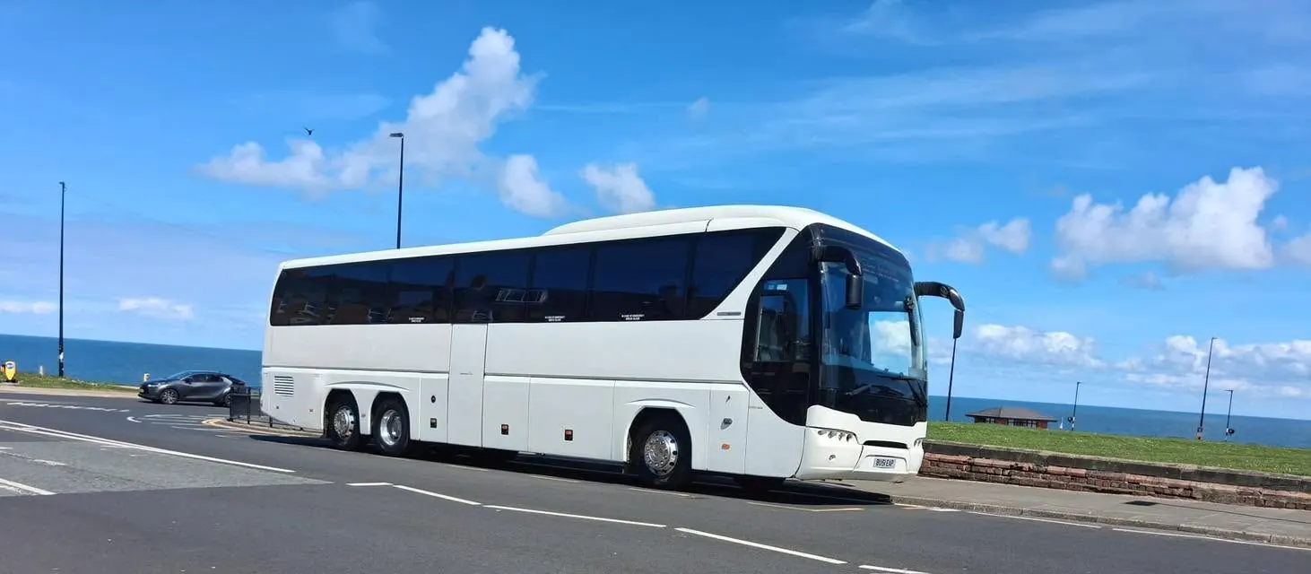 Leap Travel 55-seat Tourliner coach on the seafront at South Shields