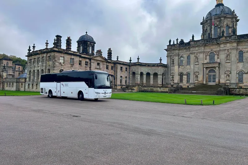 Leap Travel 57-seat coach outside Castle Howard
