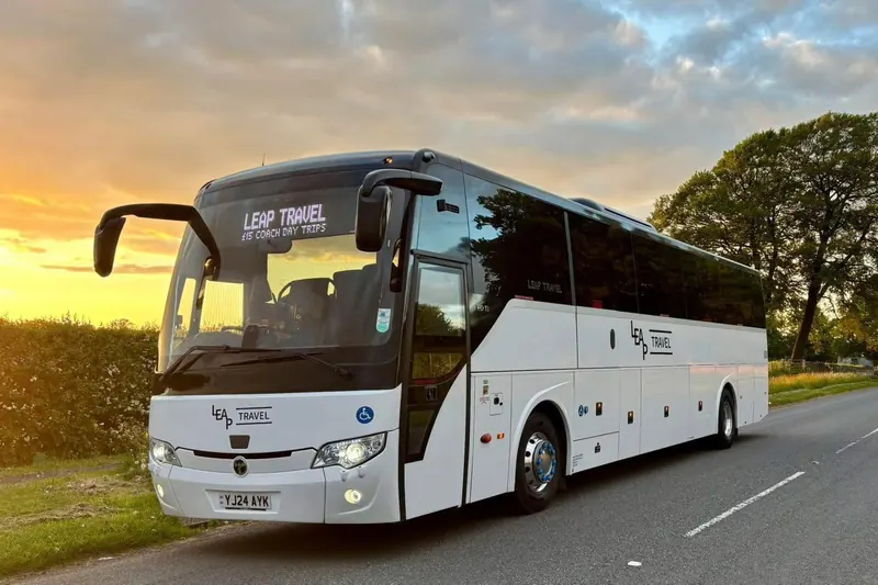 Leap Travel 57-seat Temsa executive coach at sunset